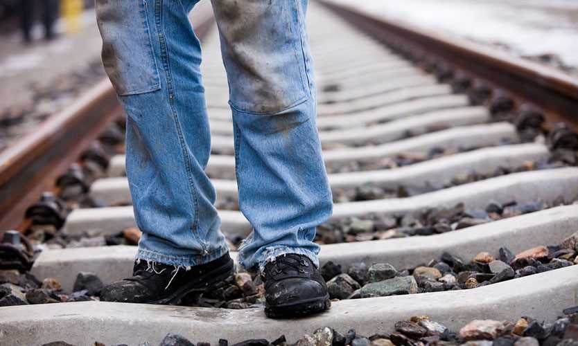 Railroad worker on tracks