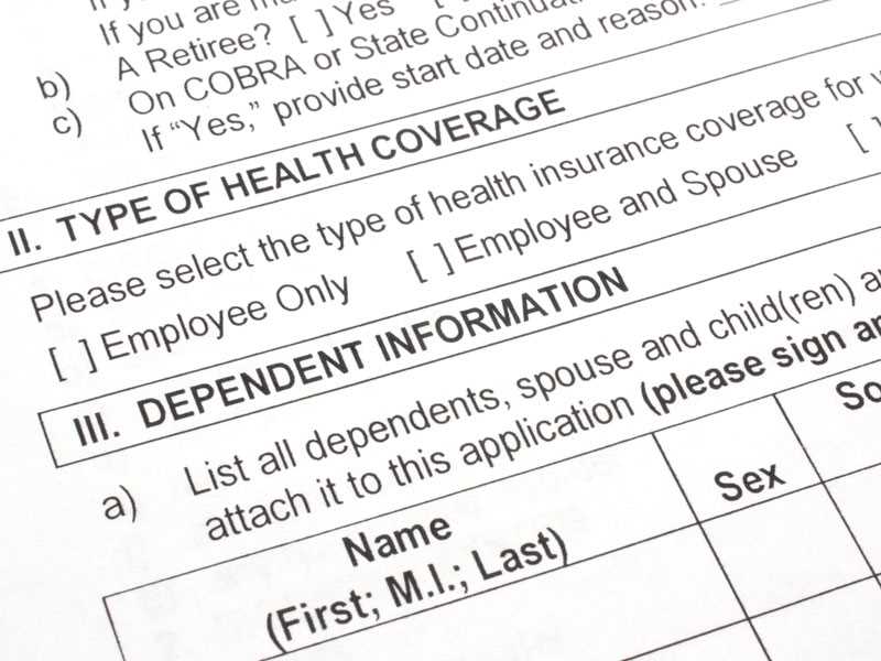 More employers charging extra for spouse when other health coverage