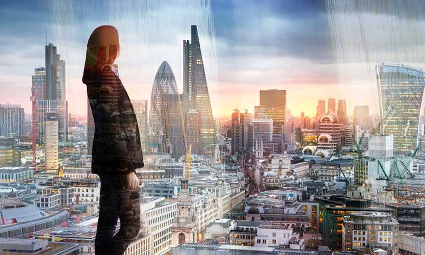 Woman overlooking London financial district